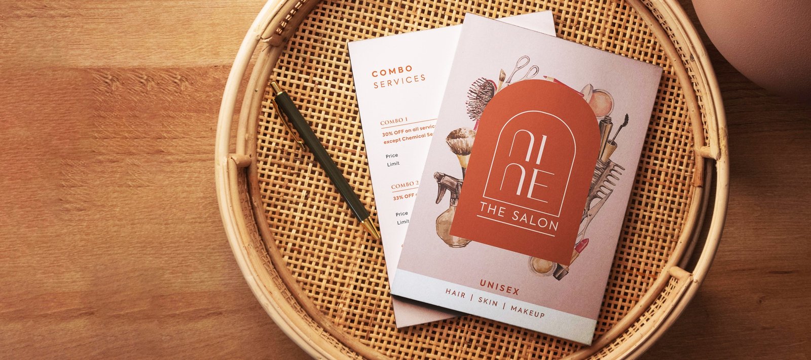 Nine The Salon services menu booklet on a rattan tray with combo offers